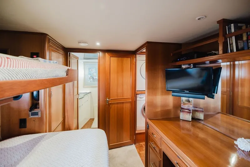 Slide: The Image of Luxurious 1999 Ocean Alexander 680 Classicco yacht interior with wood finish and modern amenities. - 68