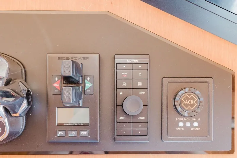 Slide: The Image of Control panel of a 1999 Ocean Alexander 680 Classicco yacht with navigation and thruster controls. - 45