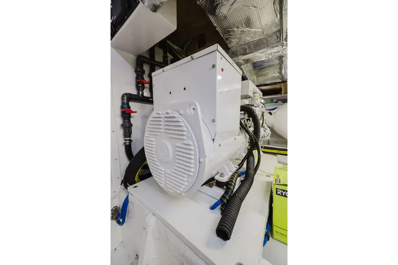 Slide: The Image of Engine room of 1999 Ocean Alexander 680 Classicco yacht, featuring mechanical components. - 103