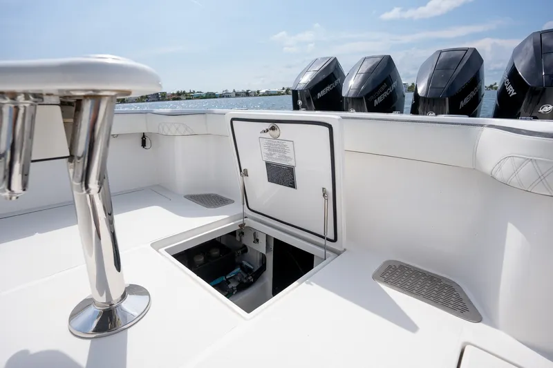 Slide: The Image of 2023 Front Runner 39 Center Console boat with open hatch and Mercury engines. - 23