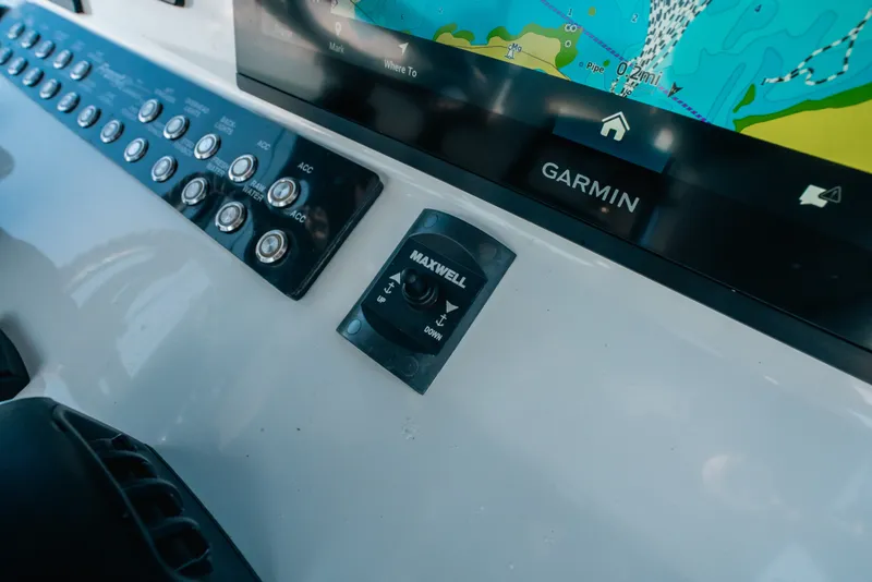 Slide: The Image of Control panel of 2023 Front Runner 39 Center Console with Garmin display and Maxwell switch. - 64