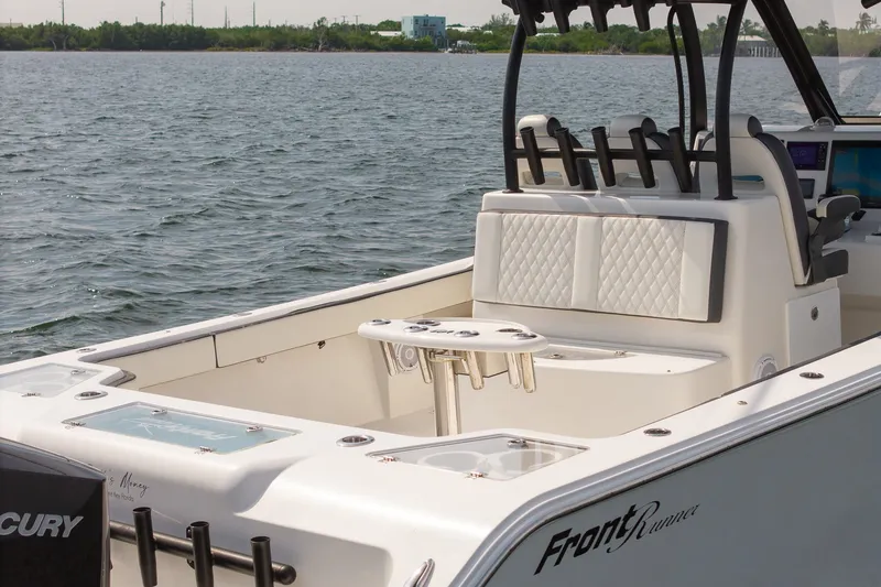 Slide: The Image of 2023 Front Runner 39 Center Console boat on water, featuring sleek seating and modern design. - 11