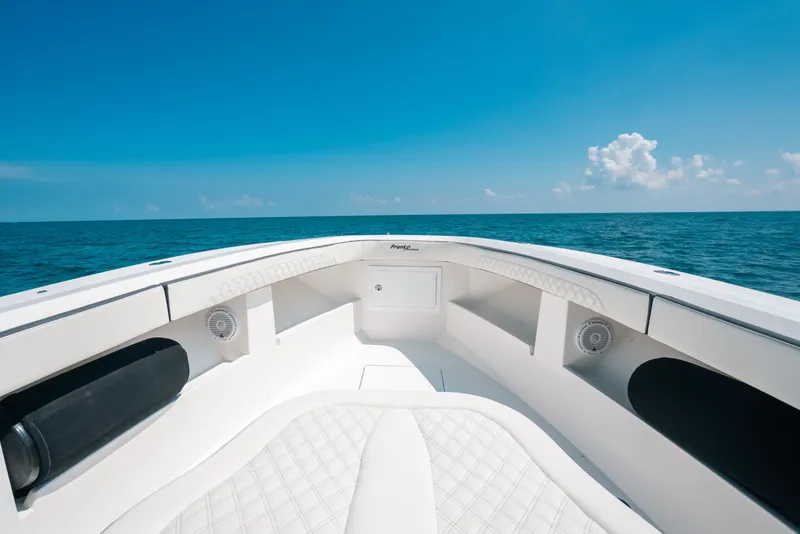 Slide: The Image of 2023 Front Runner 39 Center Console boat on open sea under clear blue sky. - 51