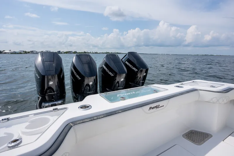 Slide: The Image of 2023 Front Runner 39 Center Console boat with four Mercury outboard engines on open water. - 42