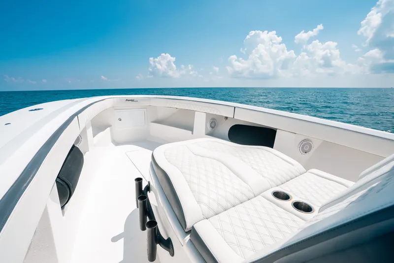 Slide: The Image of 2023 Front Runner 39 Center Console boat with luxurious seating, ocean view, and clear sky. - 50