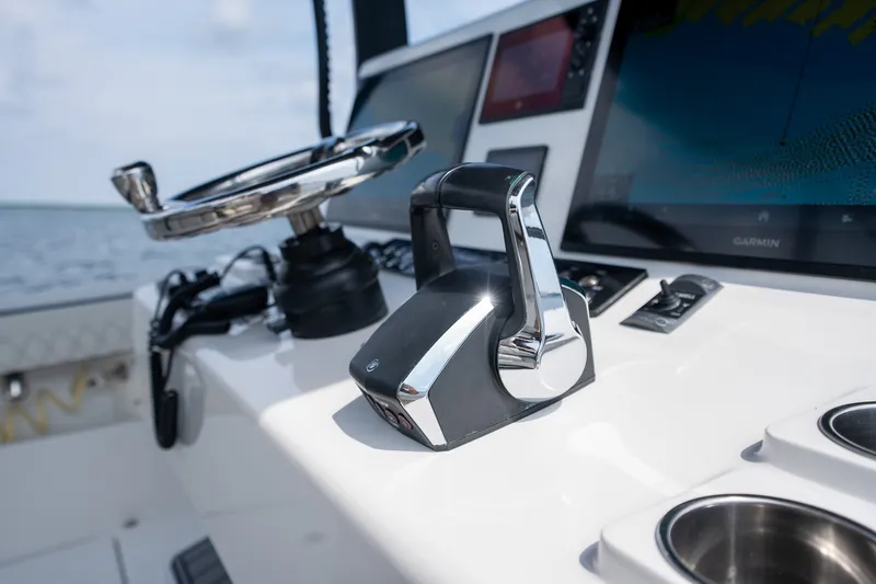 Slide: The Image of 2023 Front Runner 39 Center Console boat helm with modern controls and Garmin display. - 18