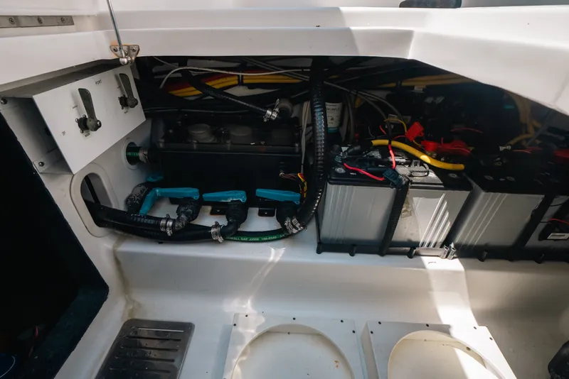 Slide: The Image of 2023 Front Runner 39 Center Console boat electrical system and battery compartment. - 79