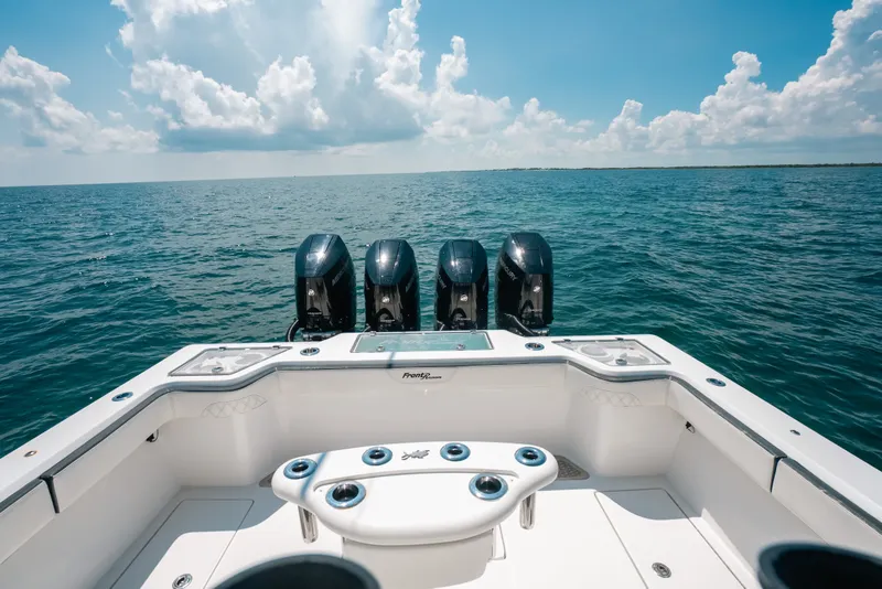 Slide: The Image of 2023 Front Runner 39 Center Console boat on open water, featuring four powerful engines. - 69