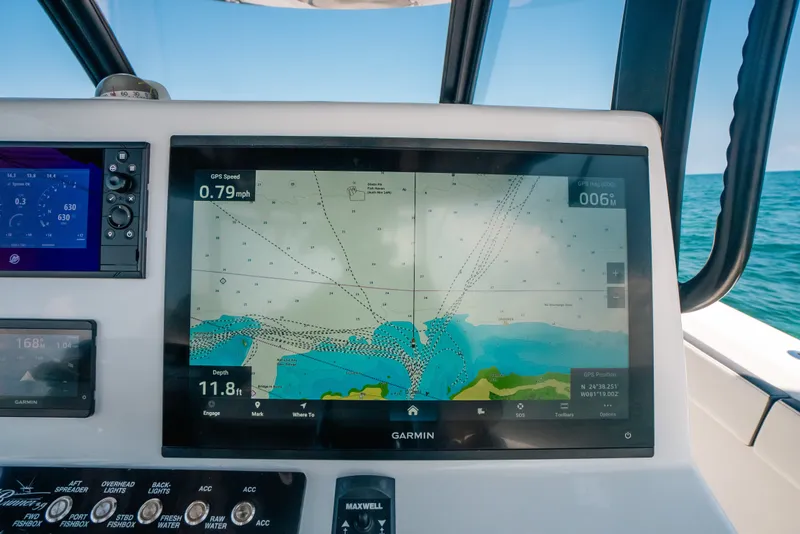 Slide: The Image of Garmin navigation display on 2023 Front Runner 39 Center Console boat, showing GPS and depth data. - 62