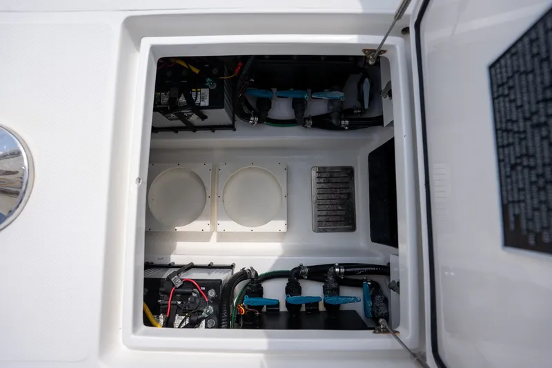 Slide: The Image of 2023 Front Runner 39 Center Console boat interior compartment with wiring and components. - 26