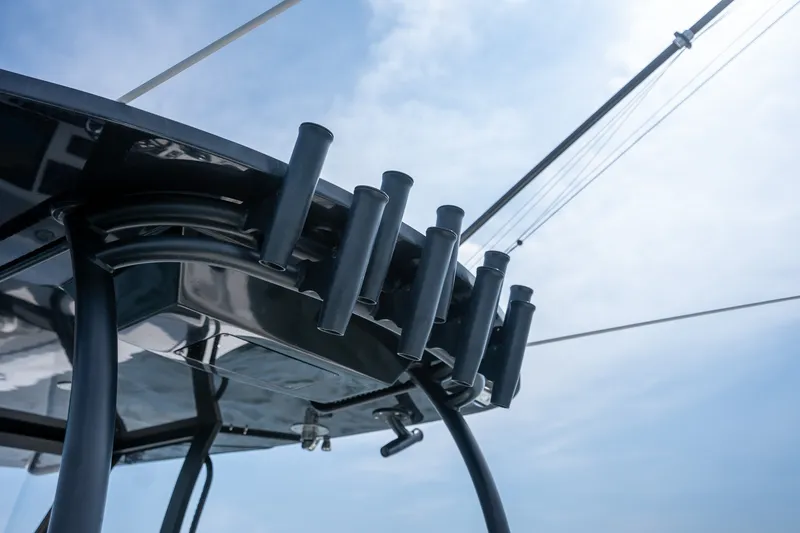 Slide: The Image of 2023 Front Runner 39 Center Console boat with rod holders against a clear sky. - 32
