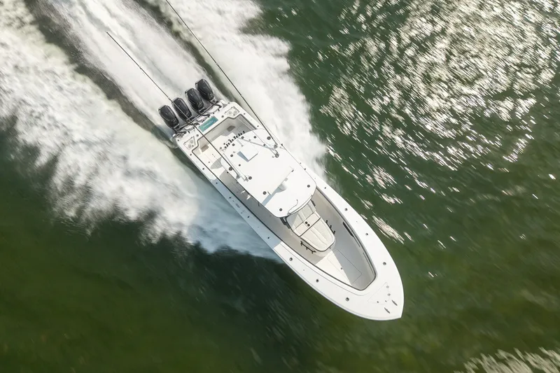 Slide: The Image of Aerial view of 2023 Front Runner 39 Center Console boat speeding on water. - 3