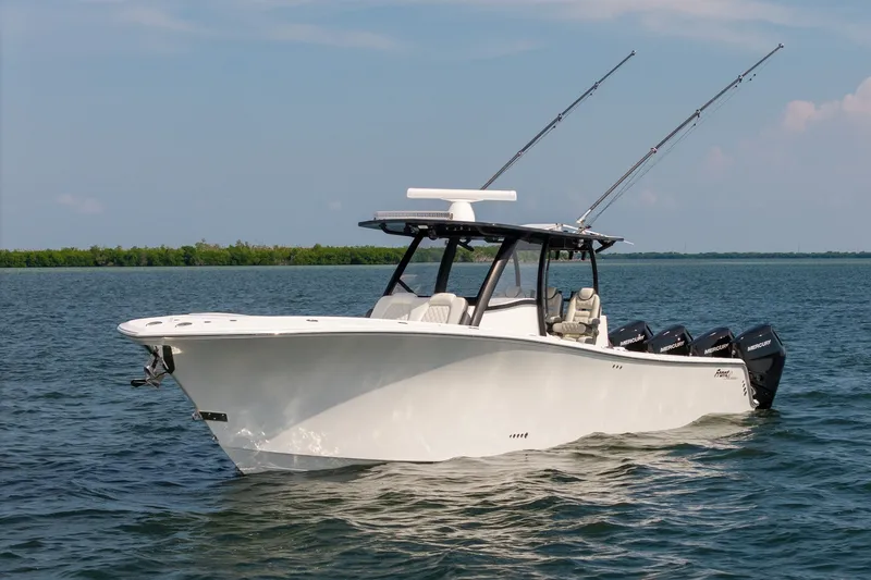 Slide: The Image of 2023 Front Runner 39 Center Console boat on calm water with fishing rods. - 6