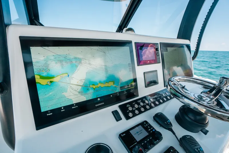 Slide: The Image of Dashboard of 2023 Front Runner 39 Center Console with navigation screens and controls. - 67