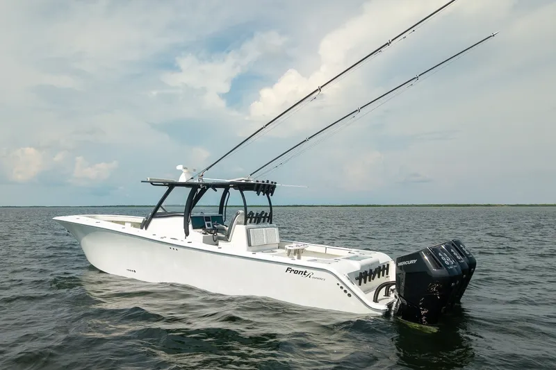 Slide: The Image of 2023 Front Runner 39 Center Console boat on open water, featuring dual Mercury engines. - 5