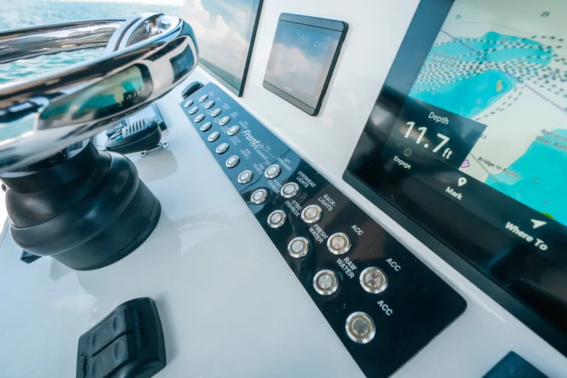 Slide: The Image of 2023 Front Runner 39 Center Console dashboard with navigation and control panel. - 63