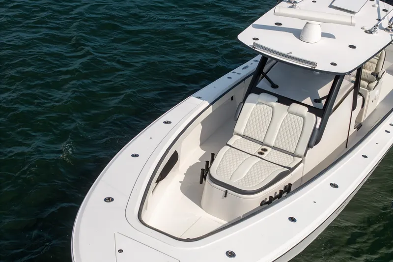 Slide: The Image of 2023 Front Runner 39 Center Console boat on water, featuring sleek design and spacious seating. - 9