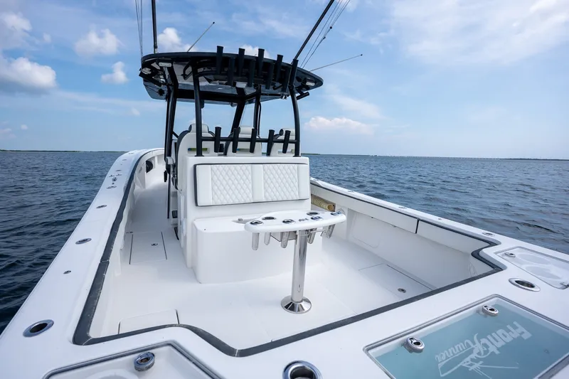 Slide: The Image of 2023 Front Runner 39 Center Console boat on open water, showcasing sleek design and spacious deck. - 20
