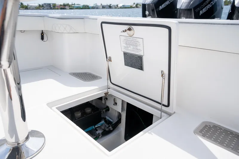 Slide: The Image of 2023 Front Runner 39 Center Console boat with open hatch revealing internal components. - 24