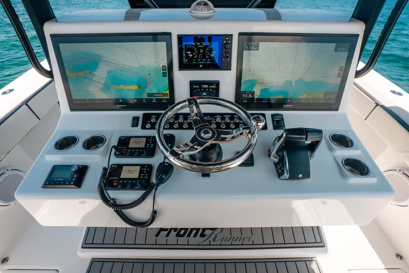 Slide: The Image of 2023 Front Runner 39 Center Console helm with dual Garmin displays and advanced controls. - 60