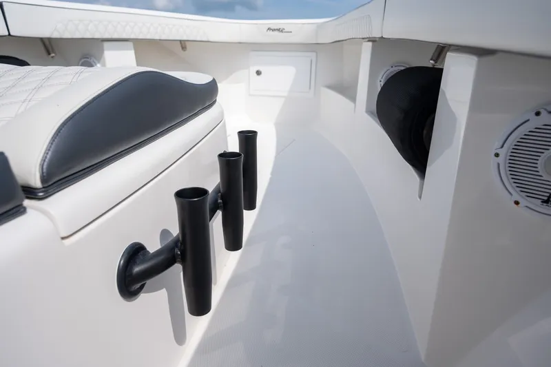 Slide: The Image of 2023 Front Runner 39 Center Console boat interior with rod holders and speakers. - 38
