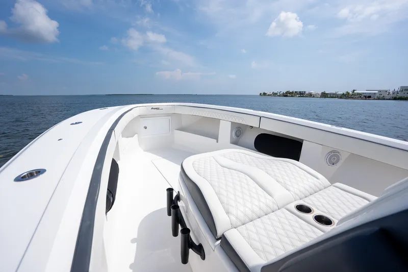 Slide: The Image of 2023 Front Runner 39 Center Console boat interior with luxurious seating on open water. - 10