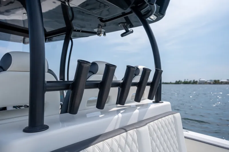 Slide: The Image of 2023 Front Runner 39 Center Console boat with rod holders on a sunny day. - 33