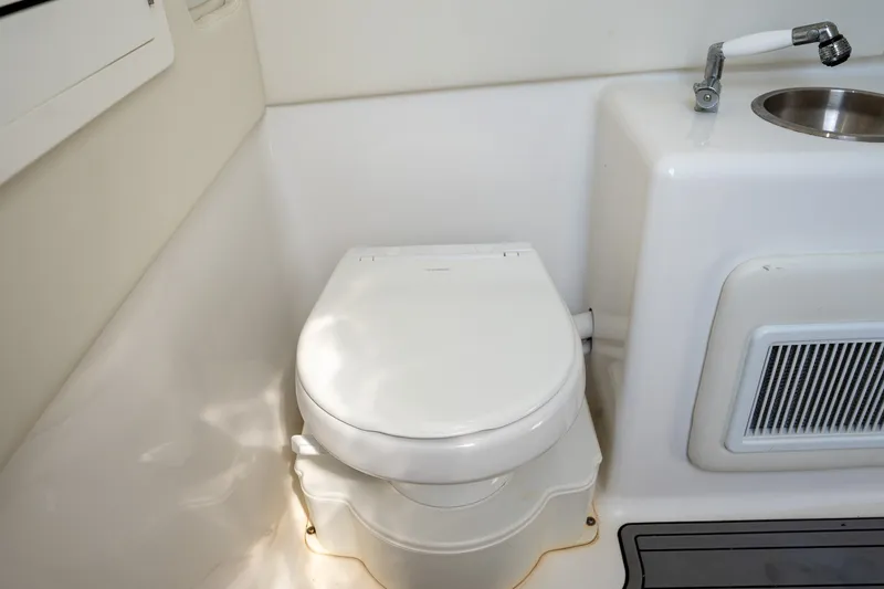Slide: The Image of 2023 Front Runner 39 Center Console boat bathroom with toilet and sink. - 49