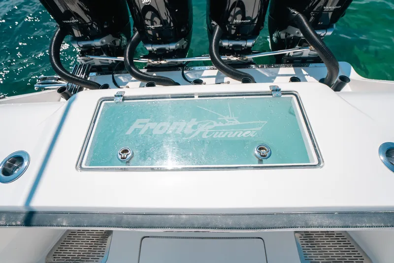 Slide: The Image of 2023 Front Runner 39 Center Console boat with Verado engines on clear water. - 57