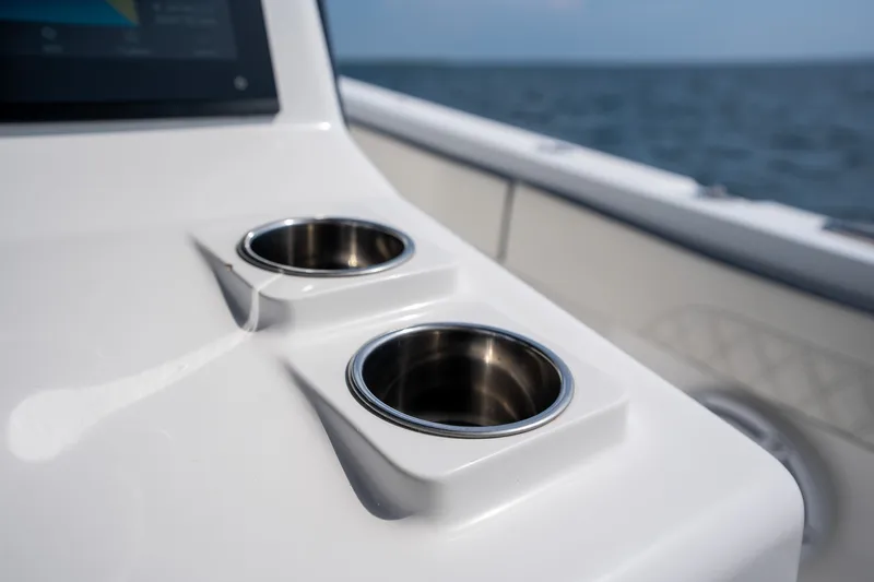 Slide: The Image of Cup holders on 2023 Front Runner 39 Center Console boat, ocean in background. - 37
