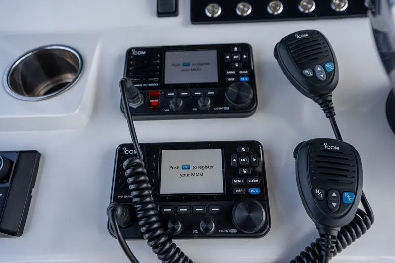 Slide: The Image of Control panel of a 2023 Front Runner 39 Center Console with Icom marine radios. - 14