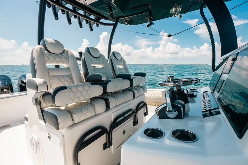 Slide: The Image of Luxurious seating on 2023 Front Runner 39 Center Console boat, ocean view in background. - 68