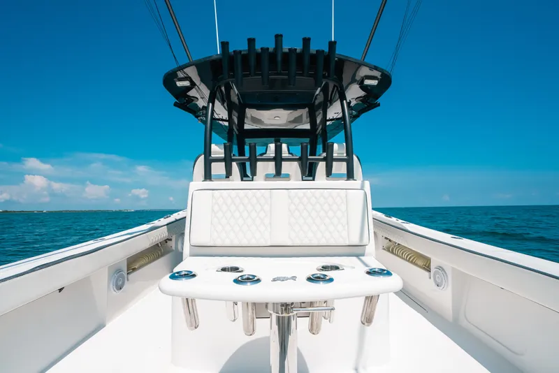 Slide: The Image of 2023 Front Runner 39 Center Console boat on open water, showcasing sleek design and seating. - 74