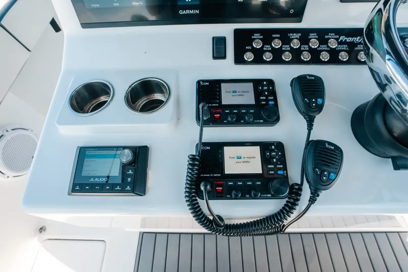 Slide: The Image of 2023 Front Runner 39 Center Console dashboard with Garmin, JL Audio, and Icom equipment. - 66