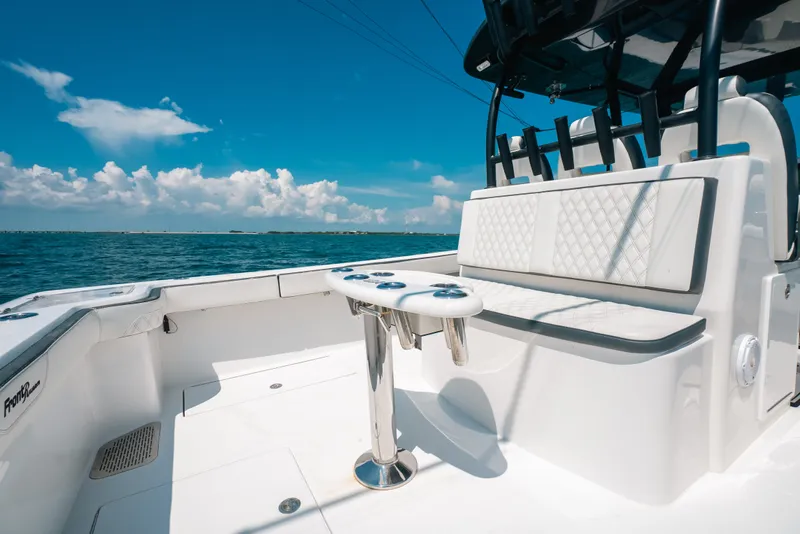 Slide: The Image of 2023 Front Runner 39 Center Console boat interior with seating and ocean view. - 71