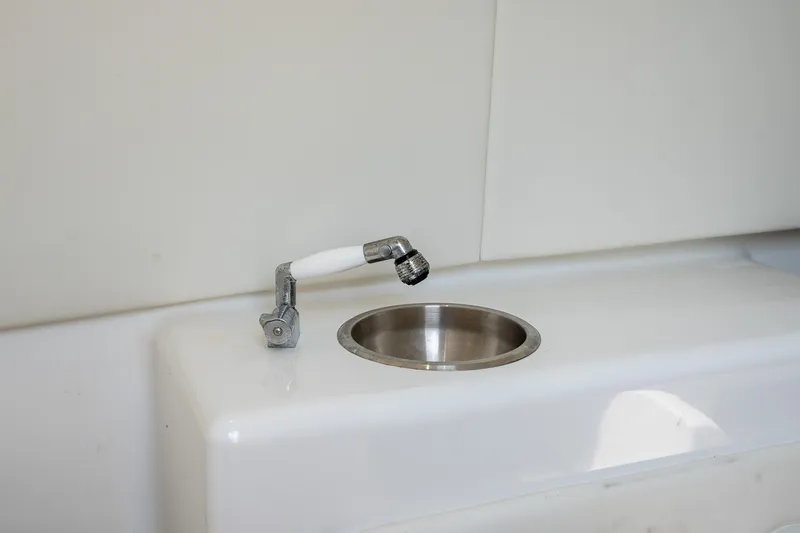 Slide: The Image of Stainless steel sink and faucet on 2023 Front Runner 39 Center Console boat. - 48