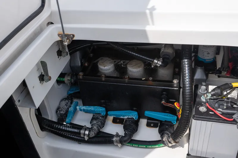 Slide: The Image of Electrical and plumbing components inside a 2023 Front Runner 39 Center Console boat. - 27