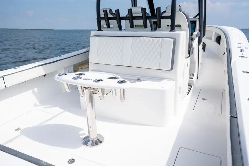 Slide: The Image of 2023 Front Runner 39 Center Console boat interior with sleek seating and rod holders. - 19