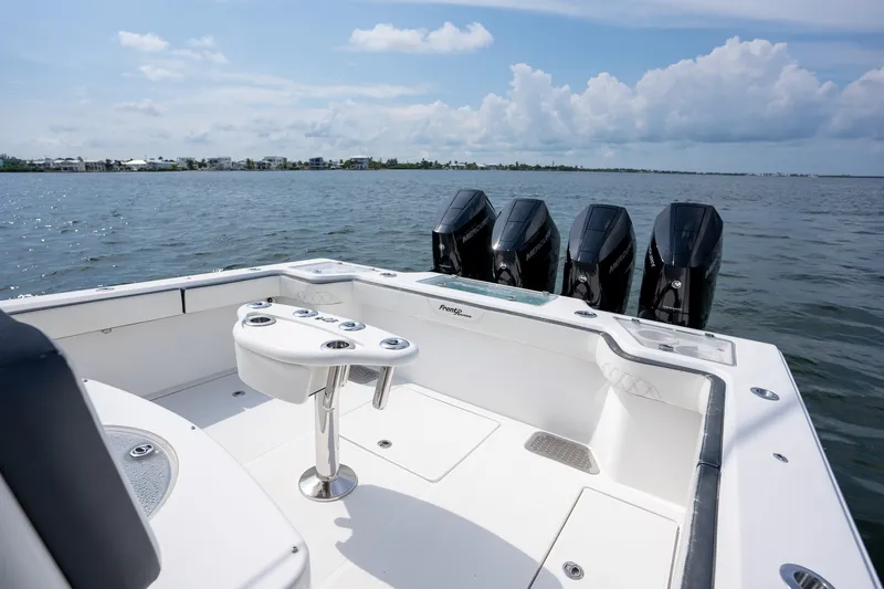 Slide: The Image of 2023 Front Runner 39 Center Console boat with four powerful engines on open water. - 31