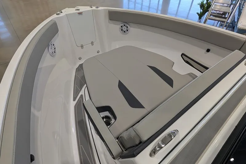 Slide: The Image of 2027 Monterey Elite 23 OB boat interior with cushioned seating and sleek design. - 15