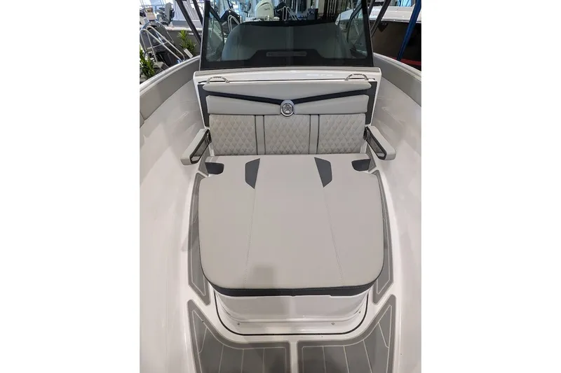 Slide: The Image of 2027 Monterey Elite 23 OB boat interior with cushioned seating and sleek design. - 17