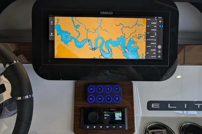 Slide: The Image of Dashboard of a 2027 Monterey Elite 23 OB boat with navigation display. - 14