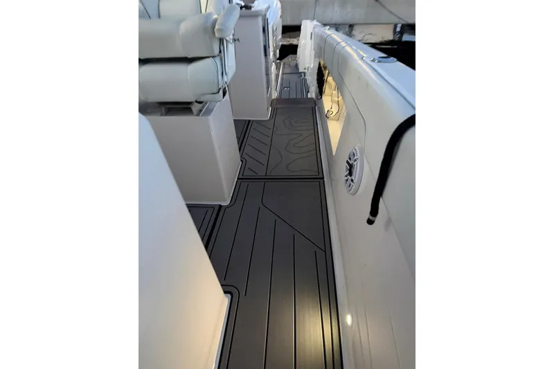 Slide: The Image of Interior view of 2020 Regal 38 SAV boat, featuring sleek seating and modern flooring. - 32