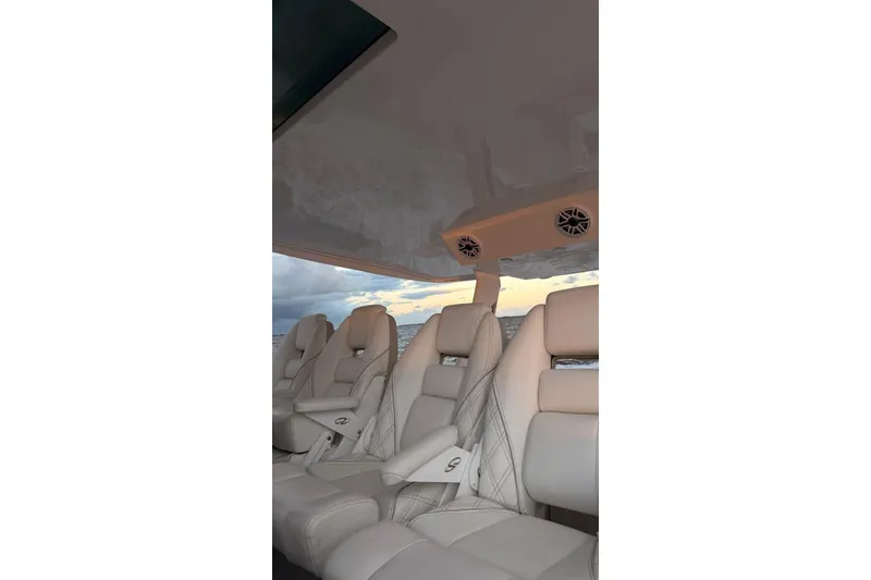 Slide: The Image of Luxurious interior seating of 2020 Regal 38 SAV boat with ocean view. - 5