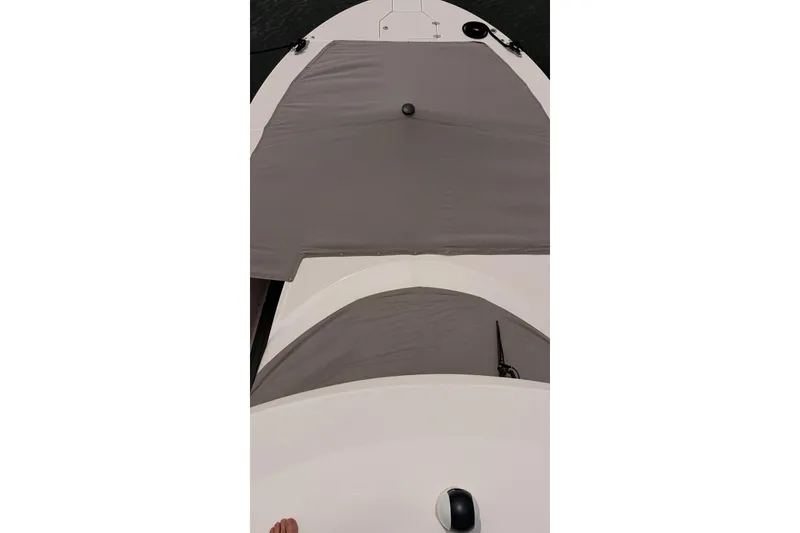 Slide: The Image of Top view of a 2020 Regal 38 SAV boat with gray covers. - 42