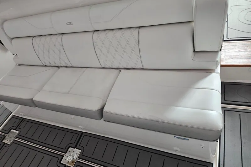 Slide: The Image of 2020 Regal 38 SAV boat interior with luxurious white seating and elegant stitching. - 3