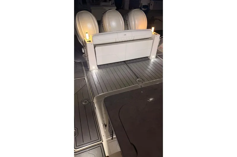 Slide: The Image of 2020 Regal 38 SAV boat deck with illuminated seating and Yamaha engines. - 9