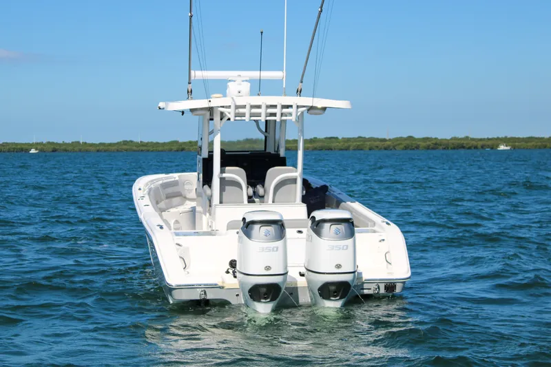 Slide: The Image of 2023 Sea Pro 320 DLX Offshore boat on water, featuring dual 350 horsepower engines. - 4