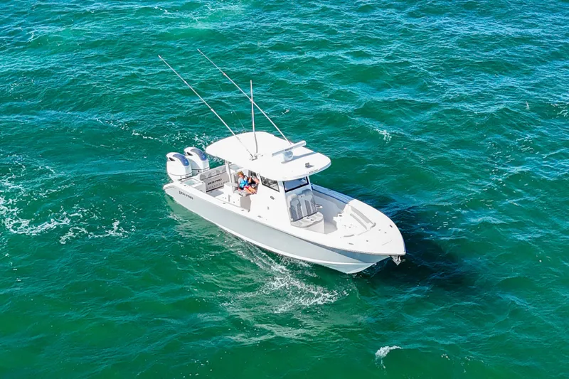 Slide: The Image of 2023 Sea Pro 320 DLX Offshore boat cruising on open water. - 7