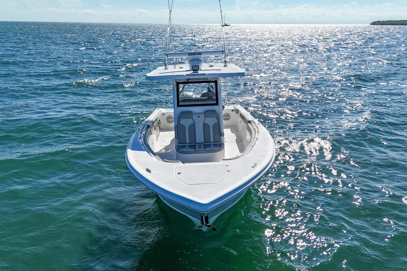 Slide: The Image of 2023 Sea Pro 320 DLX Offshore boat cruising on open water. - 9
